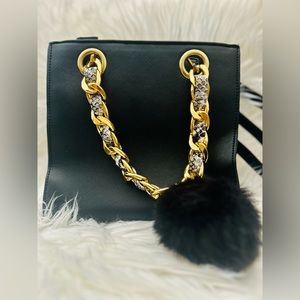 Beautiful black wallet with the sides in black and white snake print.